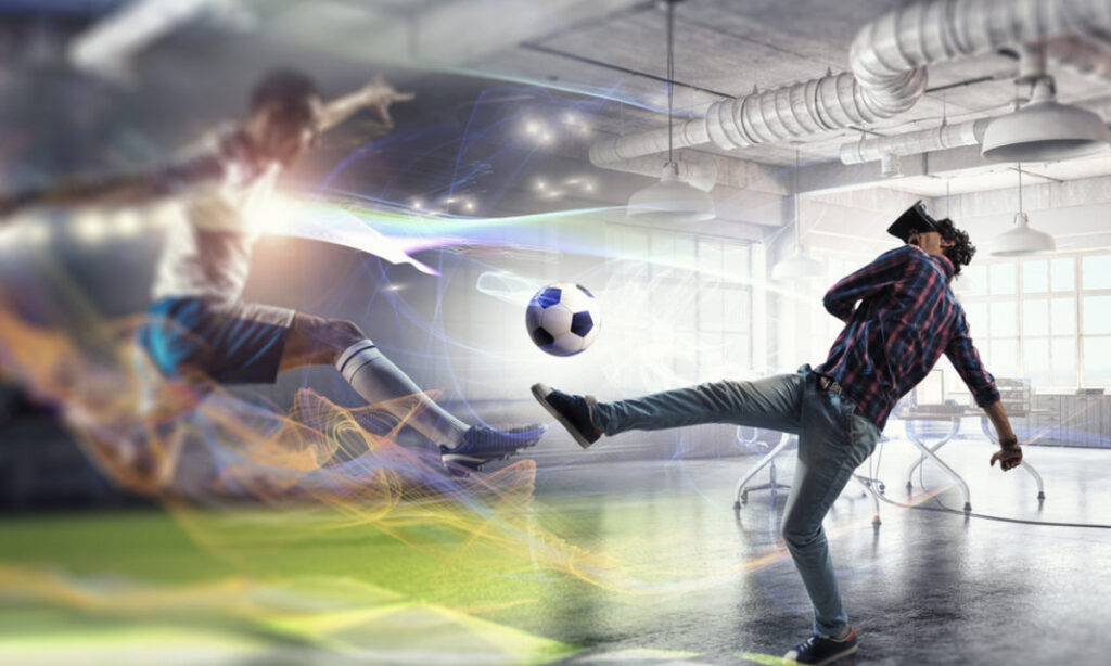 Un homme jouant au foot en mode VR