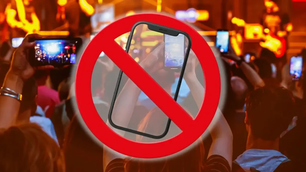 Pourquoi les concerts confisquent les téléphones en 2026 ?